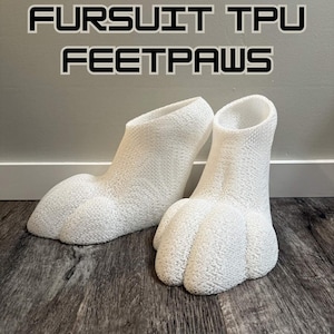 May include: A pair of white TPU fursuit feetpaws with a textured, porous surface. The feetpaws feature a high-top ankle design and defined toe sections. The text FURSUIT TPU FEETPAWS is displayed in a bold, black-outlined font above the items.