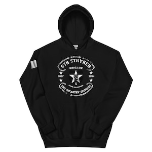 May include: Black hooded sweatshirt with a white graphic. The graphic includes the text "5th Stryker Brigade" and "2nd Infantry Division" surrounding a star and the text "Strike and Destroy". The years 2007 and 2010 are also included.