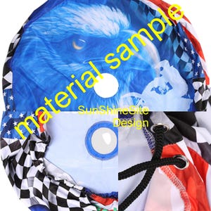 May include: A drawstring bag with a blue eagle design, a white circle, and the text "SunshineSite Design". The bag also features a checkered pattern, red and white stripes, and a black drawstring.