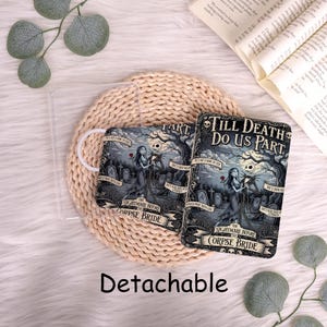 May include: Two phone cases with a spooky illustration from "The Nightmare Before Christmas" featuring Jack and Sally in a graveyard scene. The cases have the text "Till Death Do Us Part" and "Detachable".