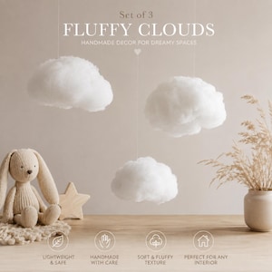 May include: A set of three white, fluffy, cloud-shaped hanging decorations. The text reads: Set of 3 FLUFFY CLOUDS HANDMADE DECOR FOR DREAMY SPACES. Below are icons with text: LIGHTWEIGHT & SAFE, HANDMADE WITH CARE, SOFT & FLUFFY TEXTURE, PERFECT FOR ANY INTERIOR.