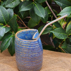 Handmade pottery ceramic straw tumbler.