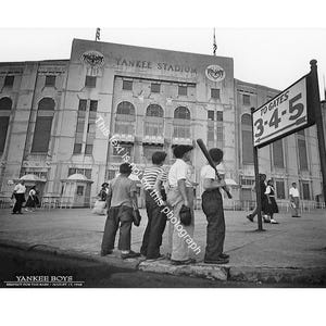 May include: Black and white photograph of Yankee Stadium with a sign pointing to gates 3-4-5. A group of boys with baseball bats and gloves stand in front of the stadium. The text "Yankee Boys" is visible.