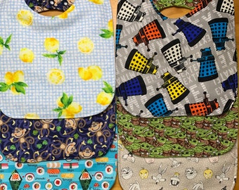 Baberos impermeables para niños grandes, elige tu estampado, doble cierre, 9 1/2 x 13 pulgadas