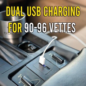 May include: Dual USB charging port fitted in the centre console of a car. The port is white and has a blue light. The console is black and has a seat adjustment button. The text "Made in US" is visible in the bottom left corner of the image. The text "Fast Shipping" is visible in the bottom right corner of the image.