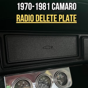 May include: A silver radio delete plate for a 1970-1981 Camaro. The plate has three round gauges with chrome bezels. The gauges are labeled "Oil", "Watt", and "Temp". The plate is made in the USA.