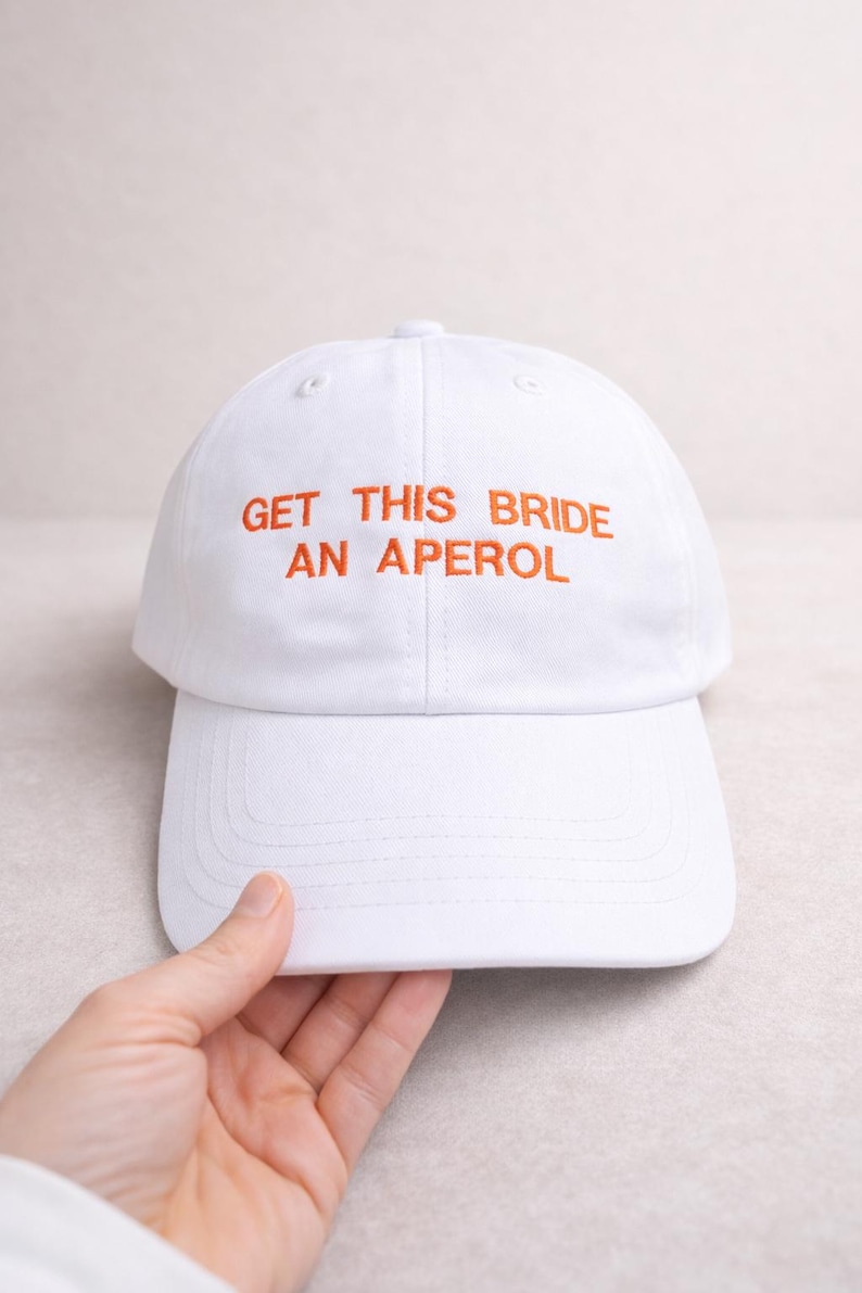 White embroidered bride cap for hen party with custom drink text, bachelorette weekend accessory and bridal shower gift