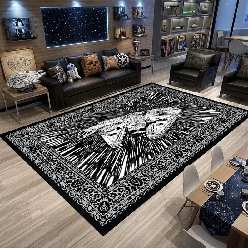 May include: Black and white Star Wars themed area rug featuring the Millennium Falcon in a speed effect design. The rug has a detailed border and is placed in a living room setting with Star Wars decor.