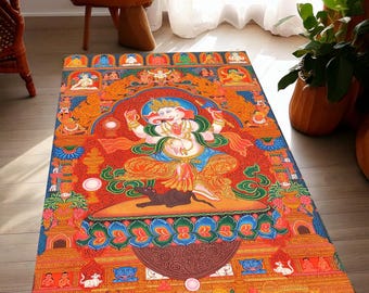 May include: A rectangular, vibrant rug featuring a central illustration of a deity with an elephant head, surrounded by intricate patterns in red, orange, blue, and green. The rug showcases detailed artwork with a spiritual theme, suitable for home decor.