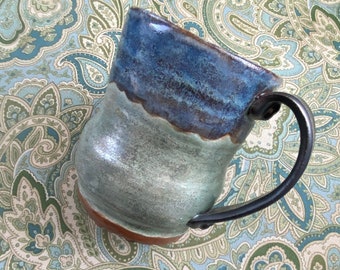 One of a kind, wheel thrown ceramic mug, glazed and ready to enjoy your favorite beverage.