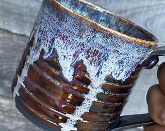 Hand thrown ceramic mug with industrial accents and dripped glaze rim