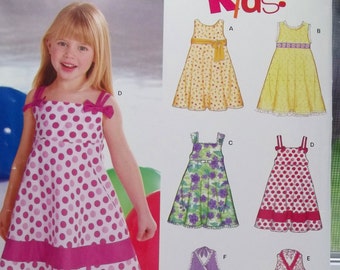 Toddler and Girl's Dress Sewing Pattern New Look 6613 Flared Dress with Ruffled Hem Halter Spring Dress Neckline Variations Size 3 - 8 UNCUT
