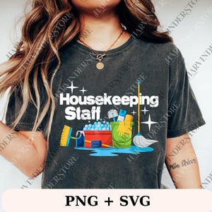 May include: Dark gray t-shirt with the text "Housekeeping Staff" and cleaning supplies graphic. The graphic includes a bucket, mop, and other cleaning tools. Below the graphic is the text "PNG + SVG".