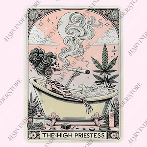 May include: A tarot card illustration featuring a skeleton in a bathtub, smoking a cigar. The card has a pink background with a crescent moon, cannabis leaf, and the text "THE HIGH PRIESTESS". The artwork is framed with decorative borders.