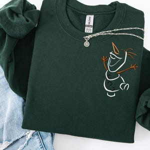 May include: A distressed wooden sign with the words "Welcome to our home" in white. The sign has a rustic finish, ideal for adding a welcoming touch to a front door or hallway.