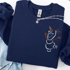 May include: A set of three ceramic mugs with a speckled, matte finish in cream, light grey, and dark grey. Each mug has a simple, minimalist design and a rounded handle.