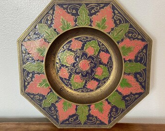 May include: Octagonal brass tray with a decorative design of pink and green floral patterns on a blue background.