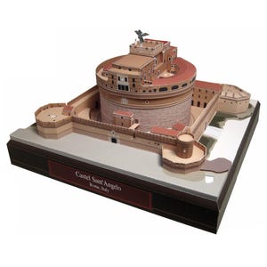 May include: A paper model kit of Castel Sant'Angelo in Rome, Italy. The model is made of brown and beige paper and features intricate details, including the castle's towers, walls, and windows. The model is displayed on a brown base with the text "Castel Sant'Angelo Rome, Italy" printed on it.