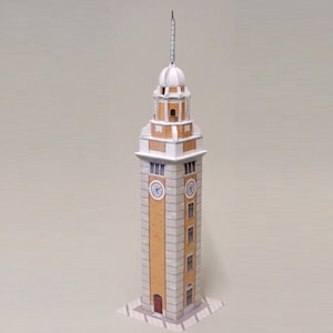May include: A paper model of a tall clock tower with a white dome and a spire. The tower has a rectangular base and is constructed with tan, white, and gray paper. Two clock faces are visible, and a red door is at the base.