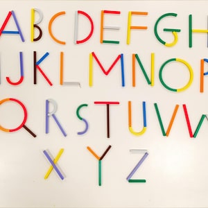 Material didáctico para la escritura de letras mayúsculas, taller individual