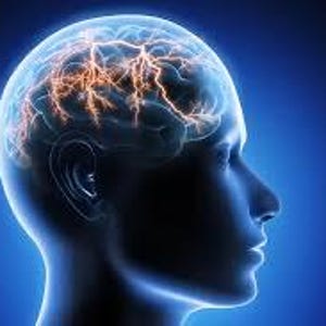 May include: A side profile of a human head with a glowing brain illustration. The brain is highlighted with orange electrical patterns against a blue background, suggesting neural activity and cognitive processes. The image is a medical or scientific visualization.