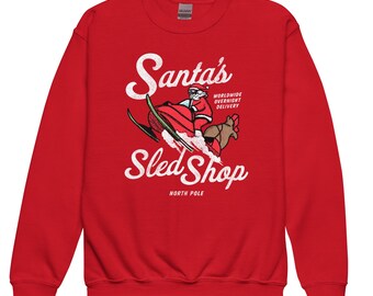 Sudadera juvenil de la tienda de trineos de Papá Noel, moto de nieve para niños, regalo de moto de nieve, moto de nieve navideña, moto de nieve de Papá Noel, camiseta navideña a juego