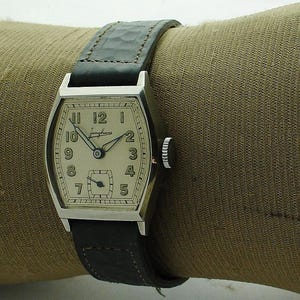 Junghans - Stock antiguo nuevo - Años cincuenta - Cuerda manual - Modelo de tanque - Uniseks - Segunda mano pequeña - Vintage - Artdeco