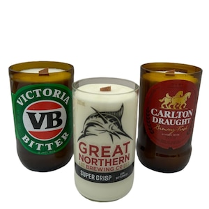 Upcycled beer bottles filled with subtly scented 100% soy wax. Wooden wicks for extra crackle and presented in a window gift box.