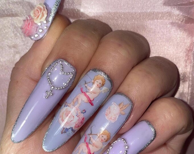 Little purple and silver cherubs with rosaries and flowers. Reusable, Press-on nails, false nails. Glossy finish