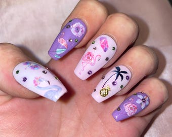 22-piece kit. Purple flamingos, roses, palm trees, flowers, and rhinestones. Sizes 0 to 10. Reusable, press-on nails, false nails. Glossy finish