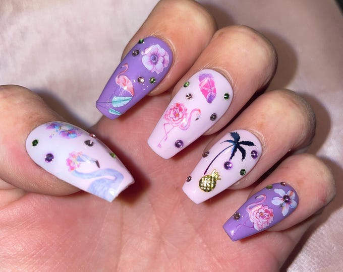 22-piece kit. Purple flamingos, roses, palm trees, flowers, and rhinestones. Sizes 0 to 10. Reusable, press-on nails, false nails. Glossy finish