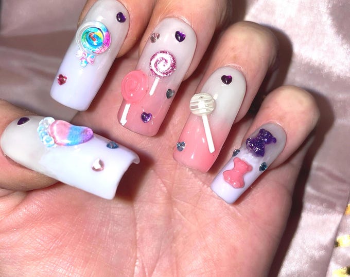 28 pieces. Small candies, pink and purple with rhinestones. Reusable. Press-on nails, false nails. Glossy finish