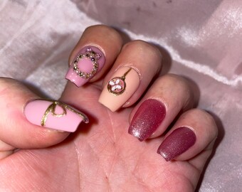 Pink and gold Christmas with rhinestones, embossed balls, gift bows. Reusable, Press-on nails, false nails. Glossy finish