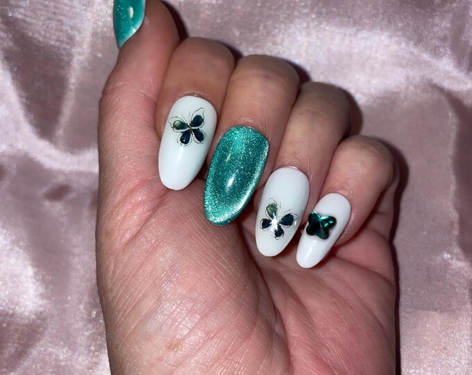 28-piece kit. Green and white cats eyes with butterflies, and rhinestones. Sizes 00 to 9. Reusable, Press-on nails, false nails, Glossy finish