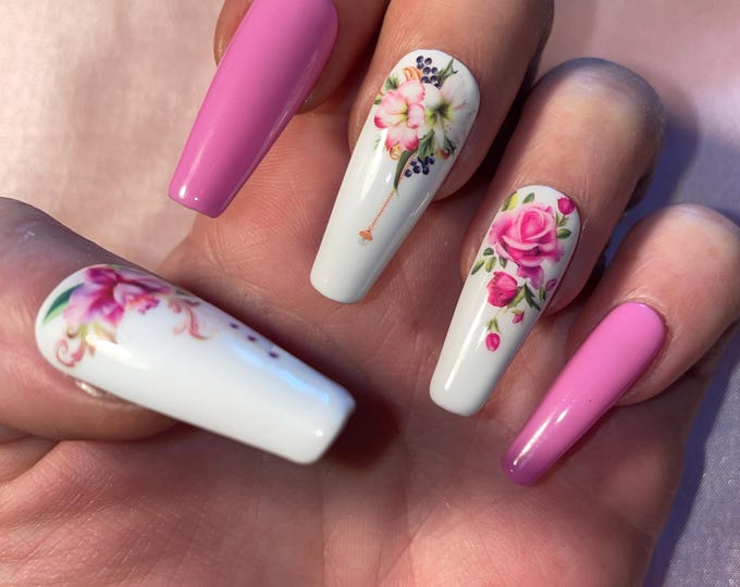 20 piece kit. Pink and purple with falling flowers. Sizes 0 to 9. Reusable, Press-on nails, false nails. Glossy finish