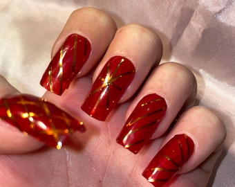 Jelly red and gold stripes. Reusable, Press-on nails, false nails. Glossy finish.