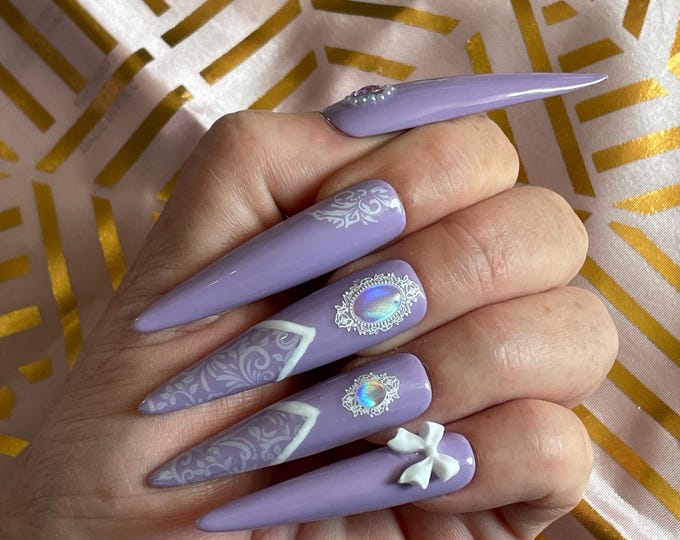 24 pieces. White and purple lace with small bows and pearls. Reusable. Press-on nails, false nails. Glossy finish.