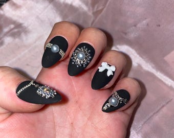 Matte black with rhinestones, pearls, bows. Reusable, Press-on nails, false nails. Matte finish