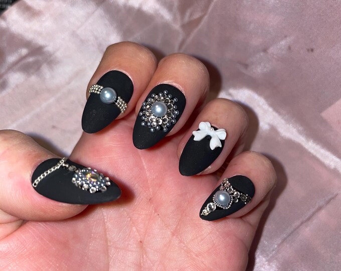 Matte black with rhinestones, pearls, bows. Reusable, Press-on nails, false nails. Matte finish