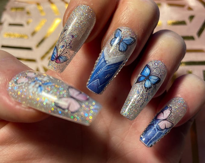 20-piece kit. Jeans, butterflies, silver studs, silver glitter. Sizes 0 to 9. Reusable, press-on nails, false nails. Glossy finish