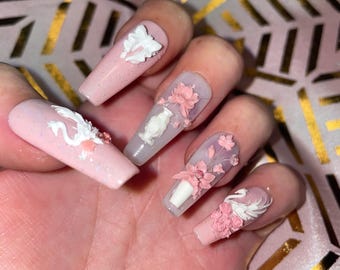 20-piece kit. Pink and milky with white signs and flowers. Sizes 0 to 9. Reusable, press-on nails, false nails. Glossy finish