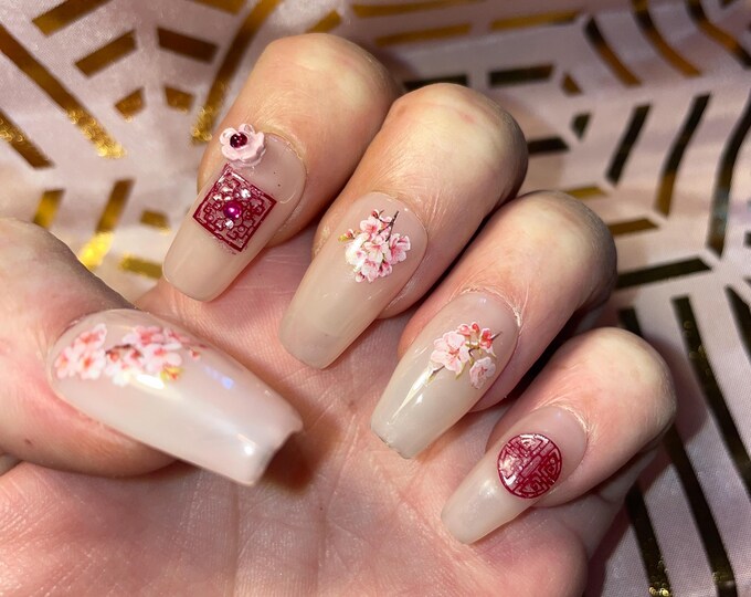 24 pieces. Medium coffin. Cherry blossom and Japanese window. Sizes 0 to 9. False nails, press on nails. Reusable. Glossy finish
