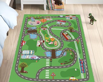 May include: A green play rug with a road design, featuring illustrations of a hospital, zoo animals, a train, and a playground. The rug has gray roads, a bridge, and a crosswalk. A toy dinosaur is standing nearby.