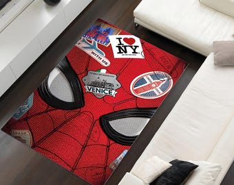 May include: Red and black area rug with a Spiderman design. The rug has a variety of travel stickers and patches, including "I Love NY" and "Venice, Italy".