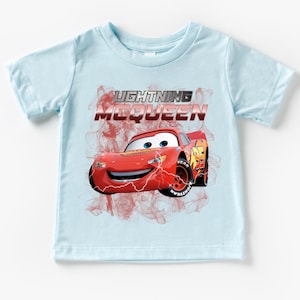 a blue shirt with a cartoon character on it
