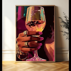 May include: A hand with gold rings holds a glass of pink wine. The hand and glass are against a dark background with hints of pink and purple.