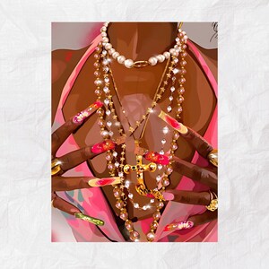 May include: A close-up of a person's chest with multiple gold chains and a large gold cross pendant. The person is wearing a pink top and has long, colorful fingernails.
