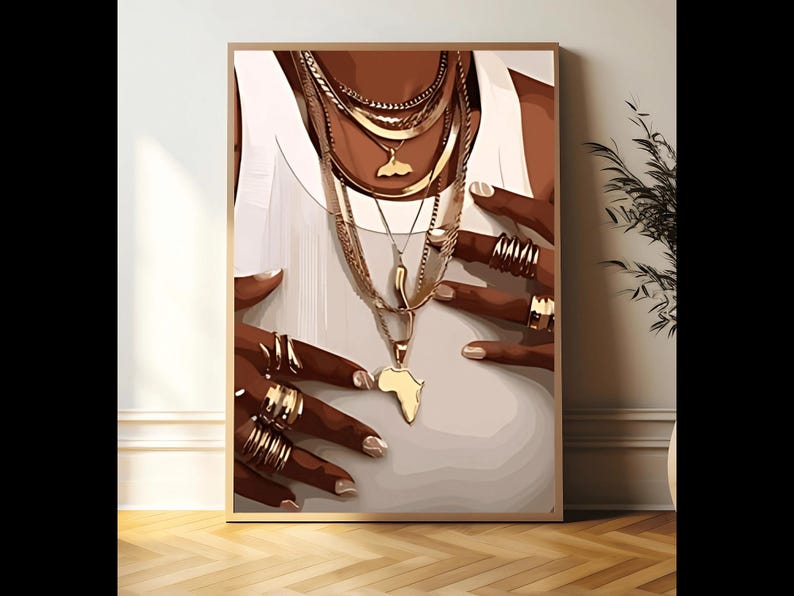 May include: A close-up of a person's hands wearing multiple gold rings and necklaces. The necklaces feature a variety of chain styles and pendants, including an outline of the African continent.