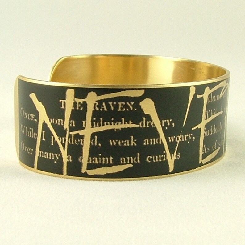May include: A gold metal bracelet with a black background and gold lettering. The text reads "THE RAVEN. ONCE upon a midnight dreary, While I pondered, weak and weary, Over many a quaint and curious As of"