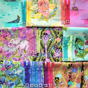 May include: A collection of colourful fabric scraps with various animal and floral patterns. The fabric scraps are arranged in a grid pattern and feature zippers along the edges. The fabric scraps are perfect for quilting, sewing, or crafting.